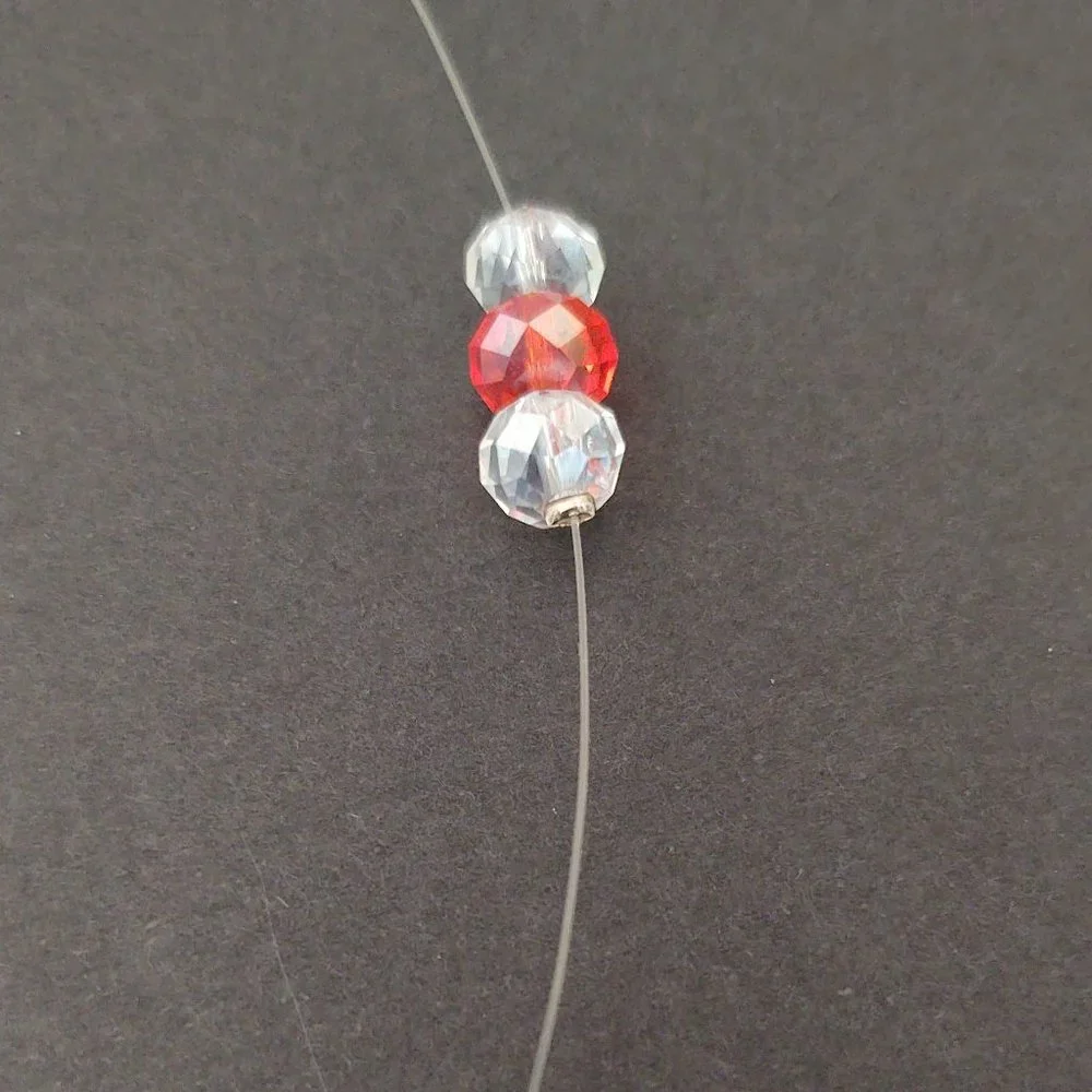 Floating clear and orange crystal necklace